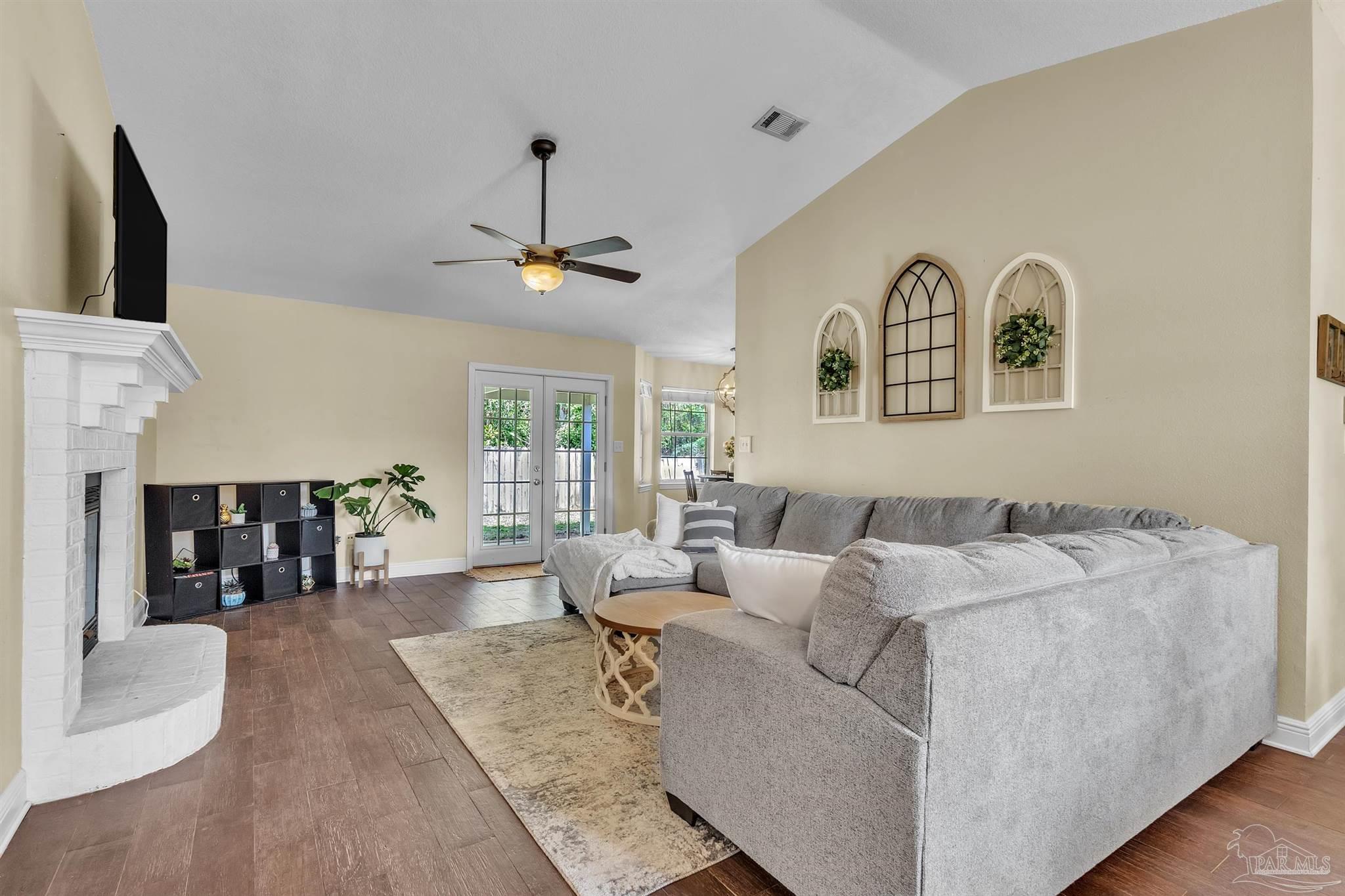 4321 Ridgeland Drive Pace, FL 32571 - Photo 2 of 36 a living room with furniture and large window