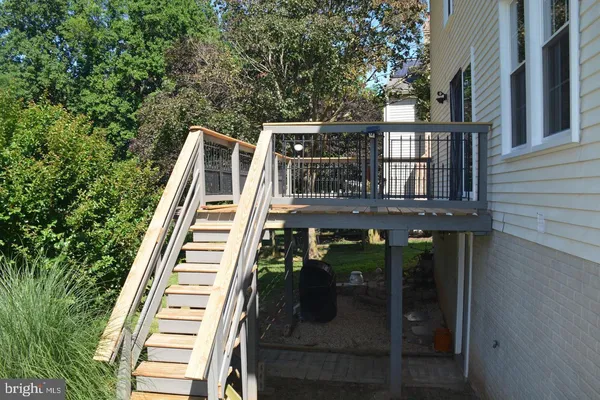 a view of a balcony with two chairs