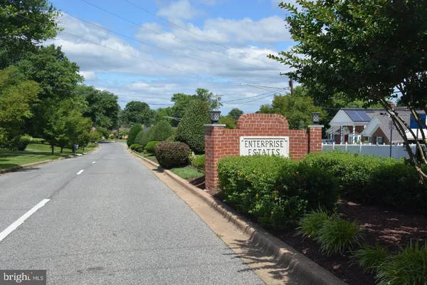 a view of a street with a building in the background