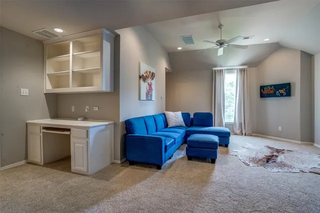 a living room with furniture and windows