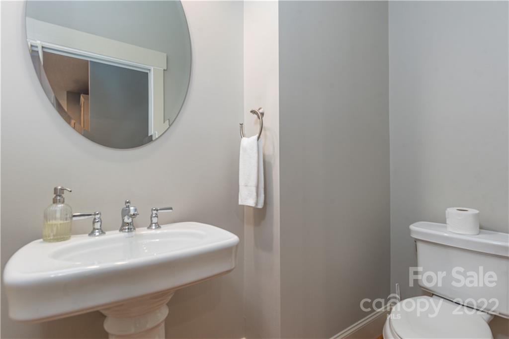 7 Fitzgerald Road Black Mountain, NC 28711 - Photo 22 of 23 a bathroom with a sink mirror and toilet