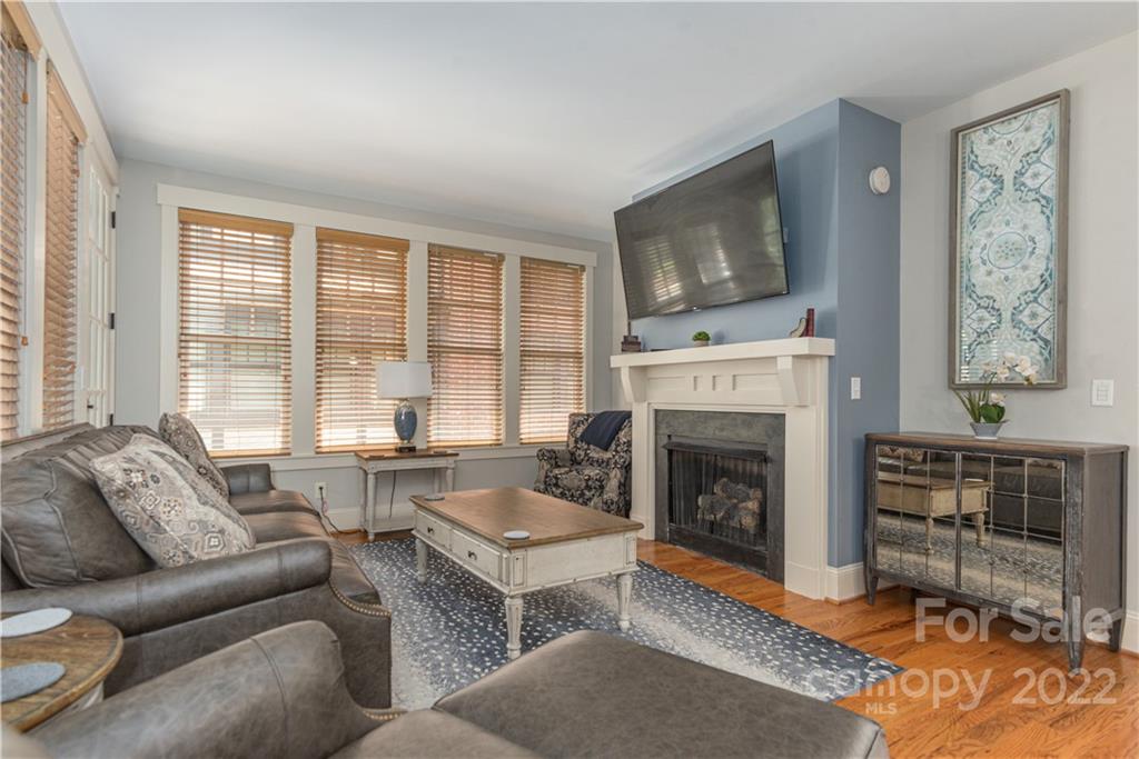 7 Fitzgerald Road Black Mountain, NC 28711 - Photo 4 of 23 a living room with furniture a flat screen tv and a fireplace
