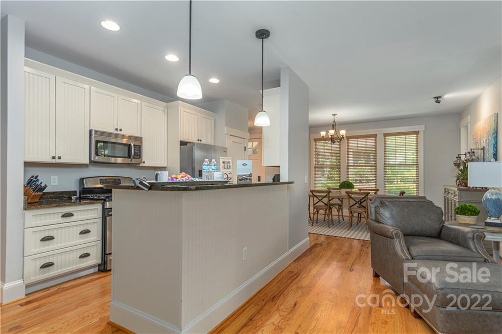 7 Fitzgerald Road Black Mountain, NC 28711 - Photo 7 of 23 a kitchen with stainless steel appliances a refrigerator a stove a sink dishwasher a oven with white cabinets and wooden floor