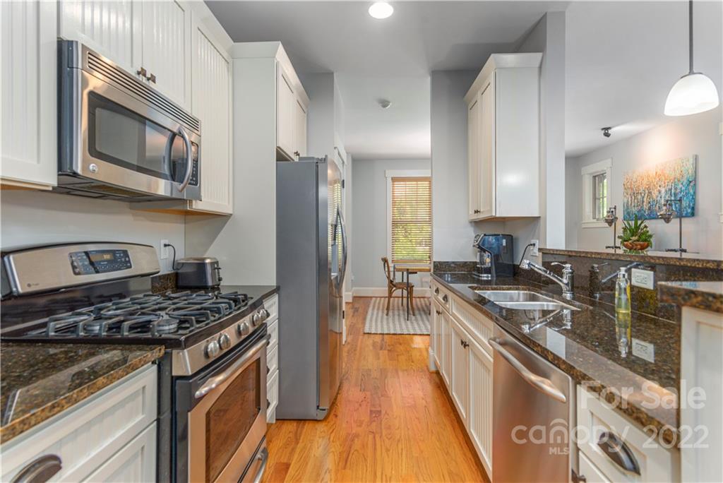 7 Fitzgerald Road Black Mountain, NC 28711 - Photo 8 of 23 a kitchen with stainless steel appliances granite countertop a stove a sink dishwasher and a refrigerator