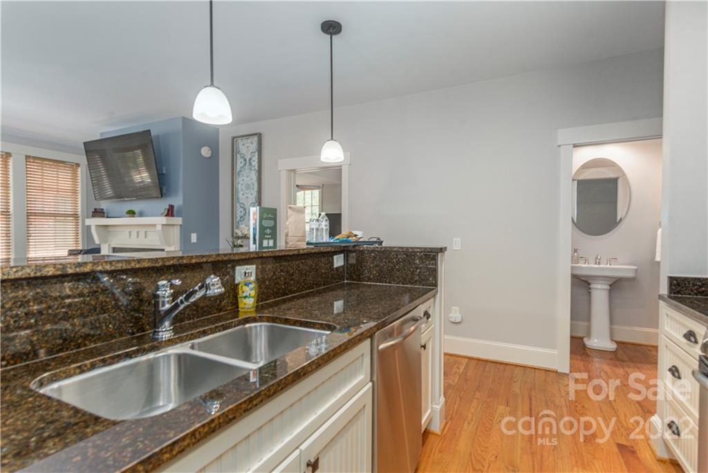 7 Fitzgerald Road Black Mountain, NC 28711 - Photo 9 of 23 a kitchen with a sink a faucet a chandelier and living room view