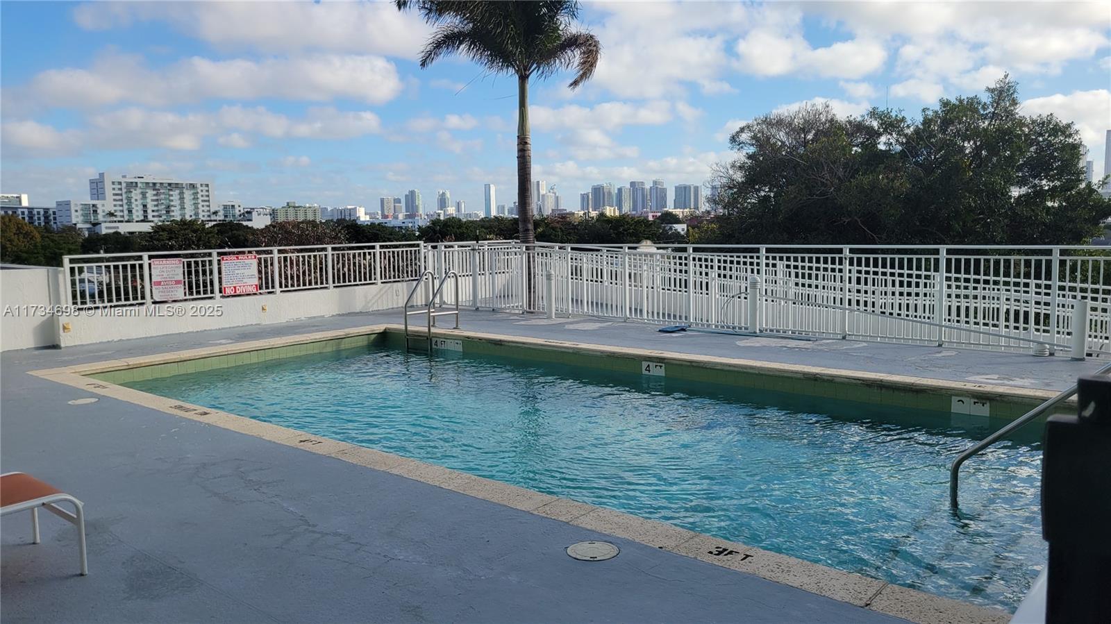 219 Northwest 12th Avenue, Unit 1004 Miami, FL 33128 - Photo 8 of 10 a view of a backyard with a lake