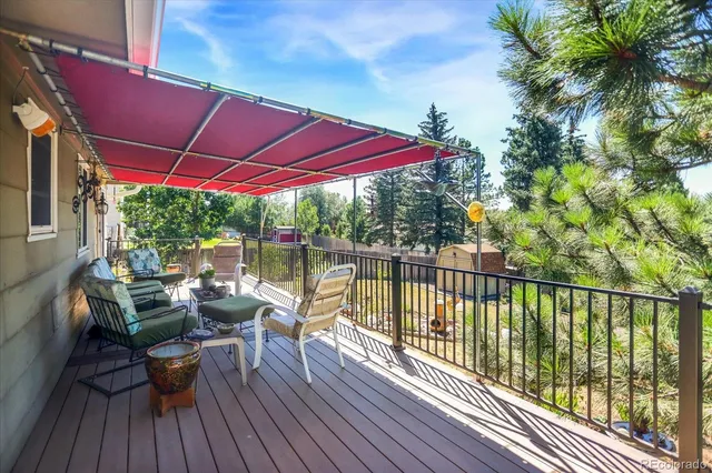 a view of balcony with deck and outdoor seating