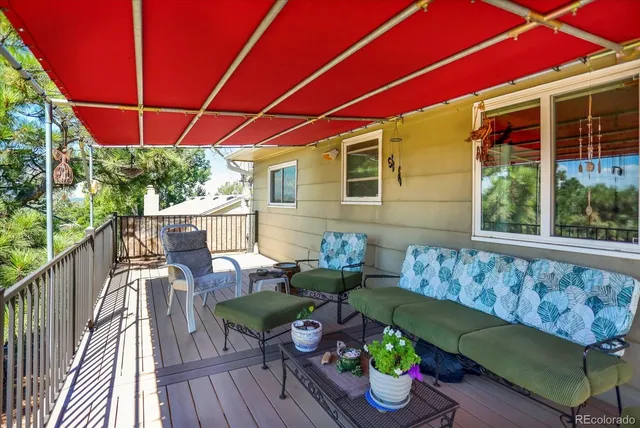 a view of a deck with furniture