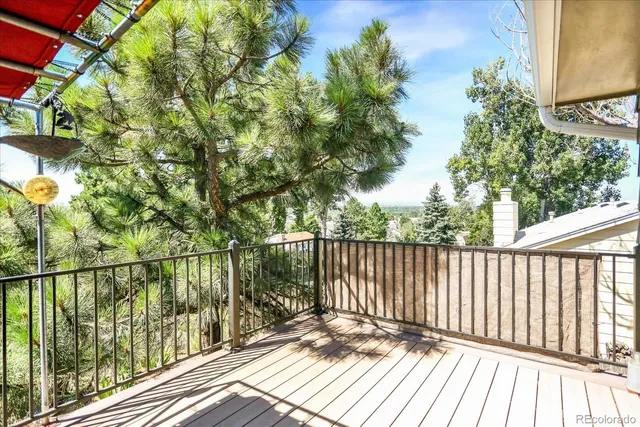 a view of balcony with wooden floor