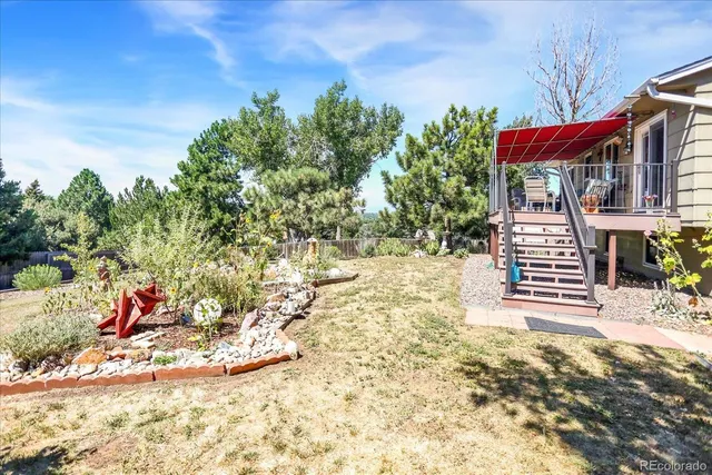 a view of a chairs in a backyard