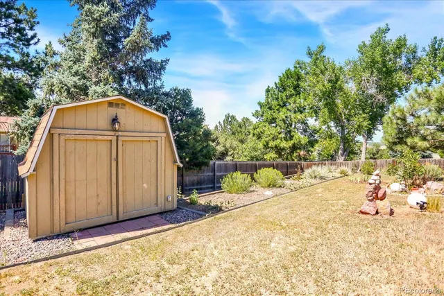 a view of a backyard of the house