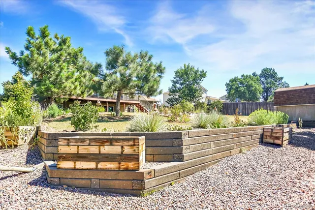 a wooden bench sitting in front of a building
