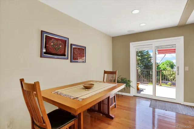 a view of a dining room with furniture window and wooden floor