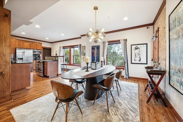 a view of a dining room with furniture window and wooden floor