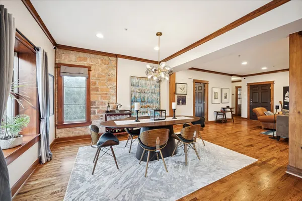a view of a dining room with furniture window and wooden floor