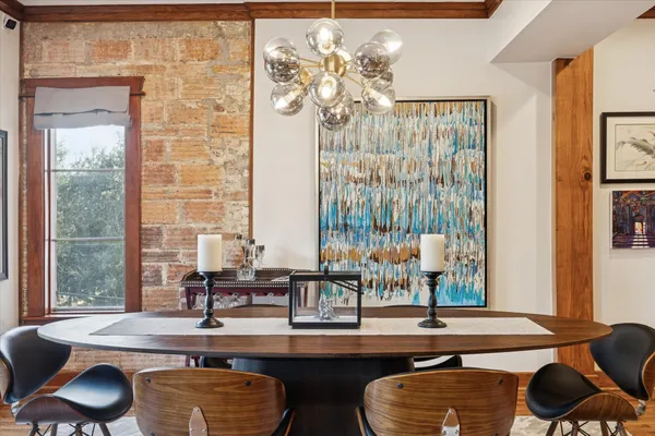 a dining room with table and chairs