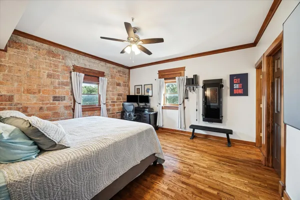 a bed room with a bed and a chandelier