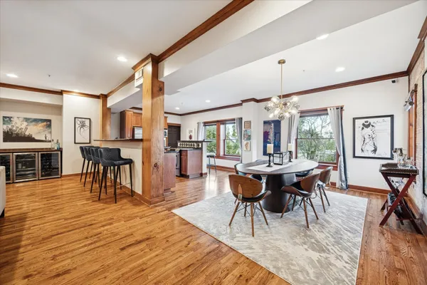 a view of a dining room with furniture and wooden floor