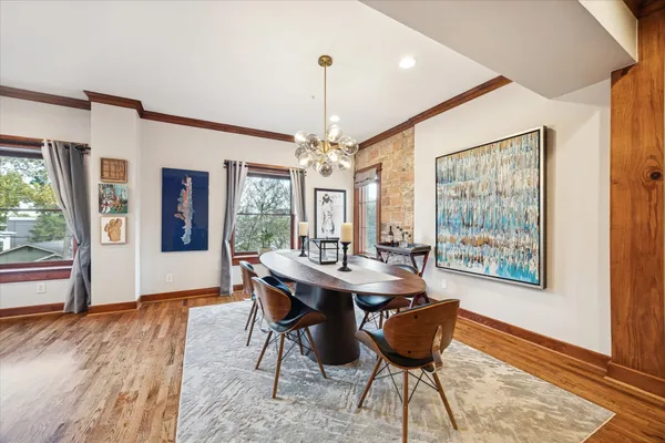 a view of a dining room with furniture window and wooden floor