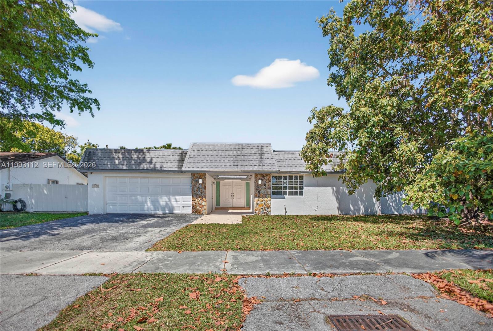 13471 Southwest 99th Terrace Miami, FL 33186 - Photo 4 of 44 a view of a house next to a yard