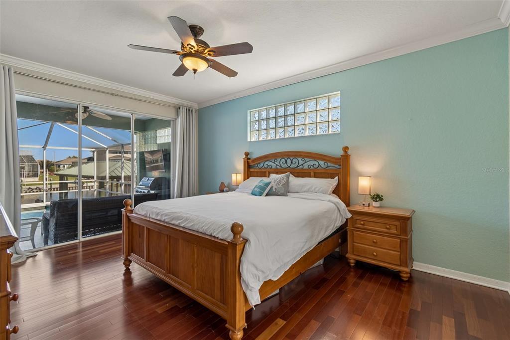 703 Bunker View Drive Apollo Beach, FL 33572 - Photo 19 of 49 a bedroom with a bed and a large window