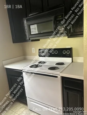 a kitchen with a stove and a microwave