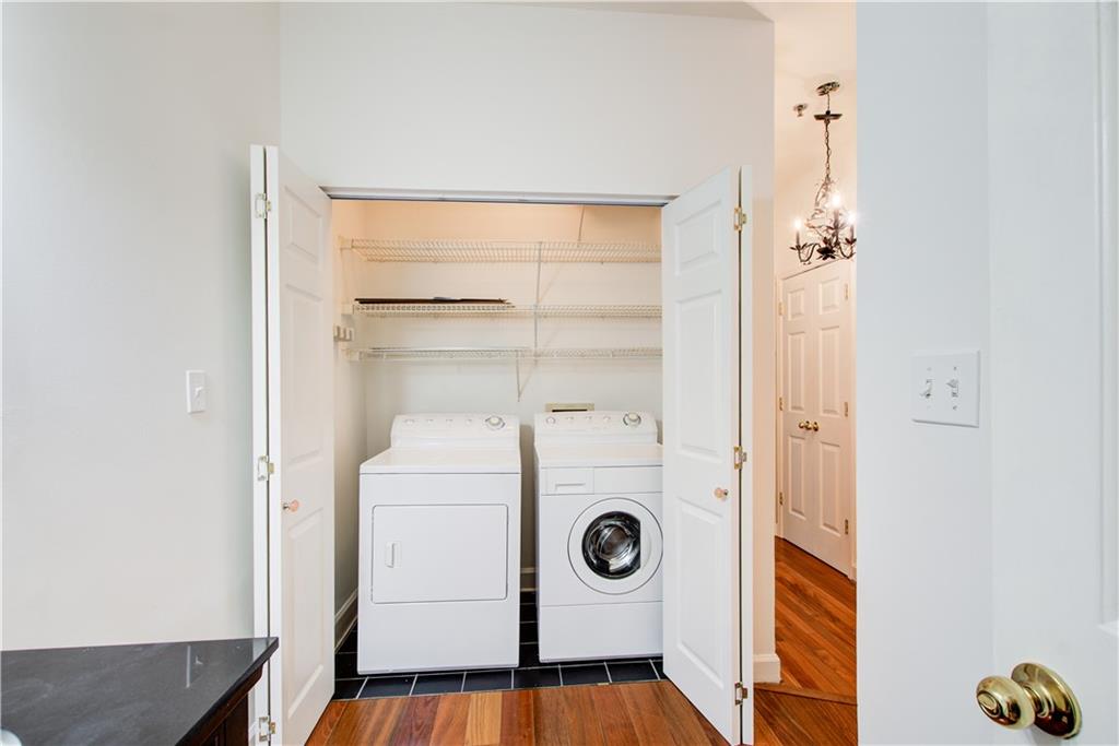 2865 Lenox Road Northeast, Unit 102 Atlanta, GA 30324 - Photo 11 of 35 a utility room with dryer and washer