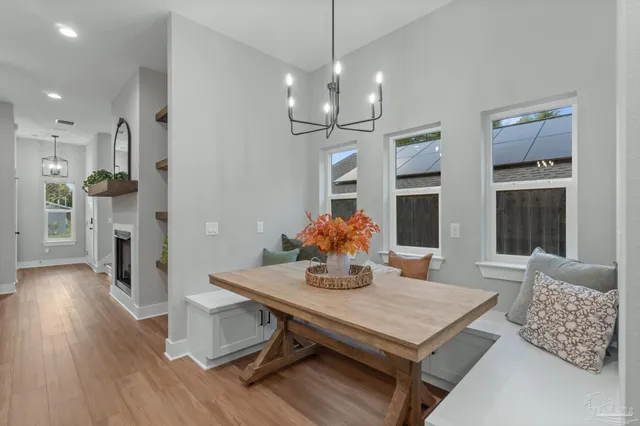 a view of a dining room with furniture window and wooden floor