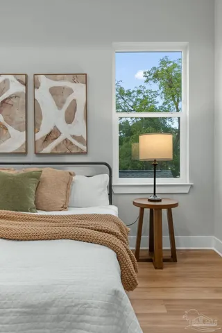 a bedroom with a bed and window