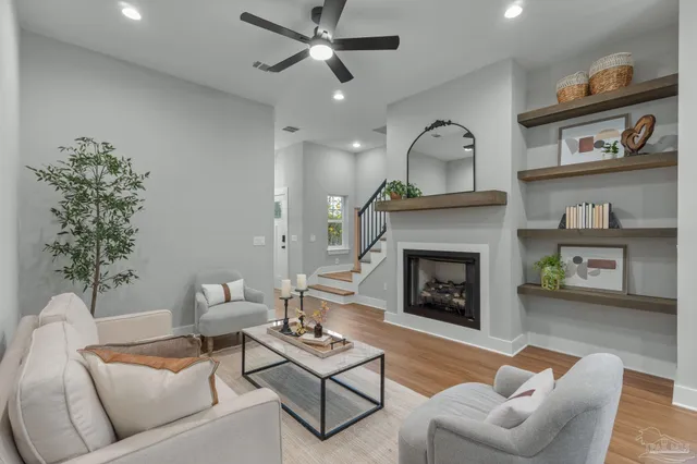a living room with furniture and a fireplace
