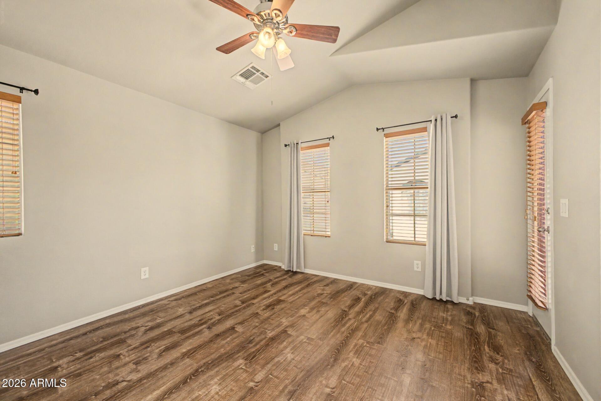 2725 East Mine Creek Road, Unit 2172 Phoenix, AZ 85024 - Photo 16 of 28 an empty room with windows and fan