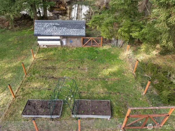 a aerial view of a house with balcony and garden