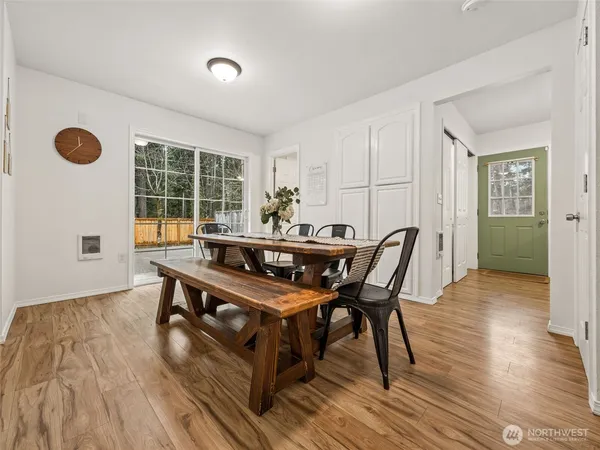 a view of a dining room with furniture and window
