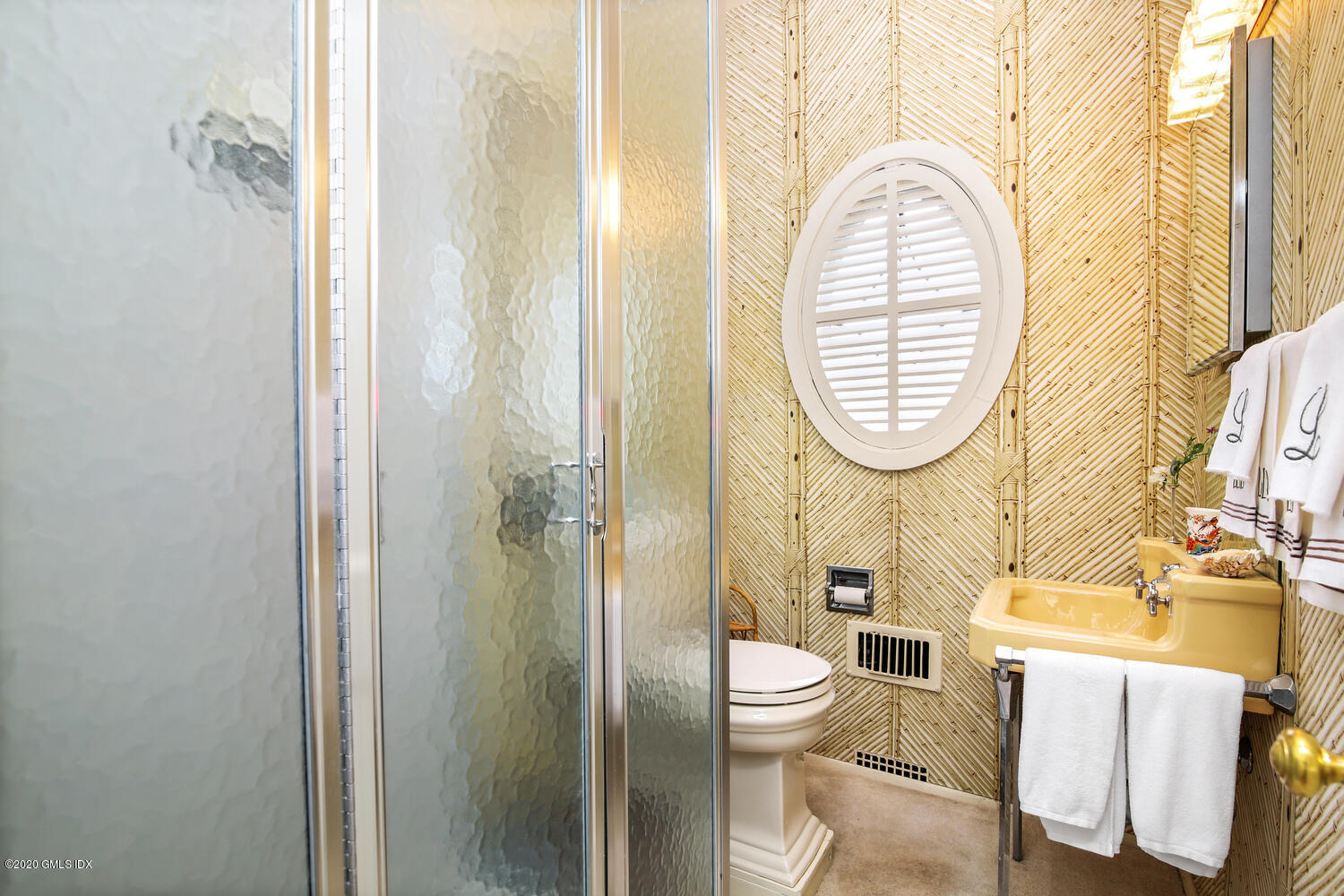 28 Pheasant Lane Greenwich, CT 06830 - Photo 23 of 49 a bathroom with a mirror a sink and a toilet