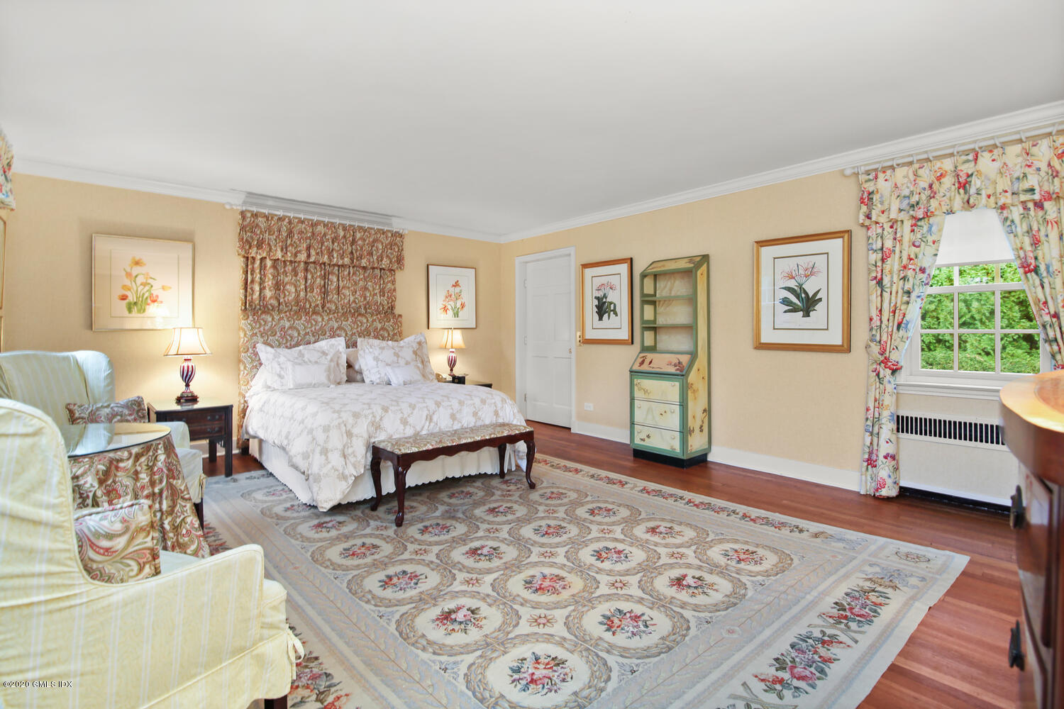 28 Pheasant Lane Greenwich, CT 06830 - Photo 31 of 49 a bedroom with a bed a couch and a window with wooden floor