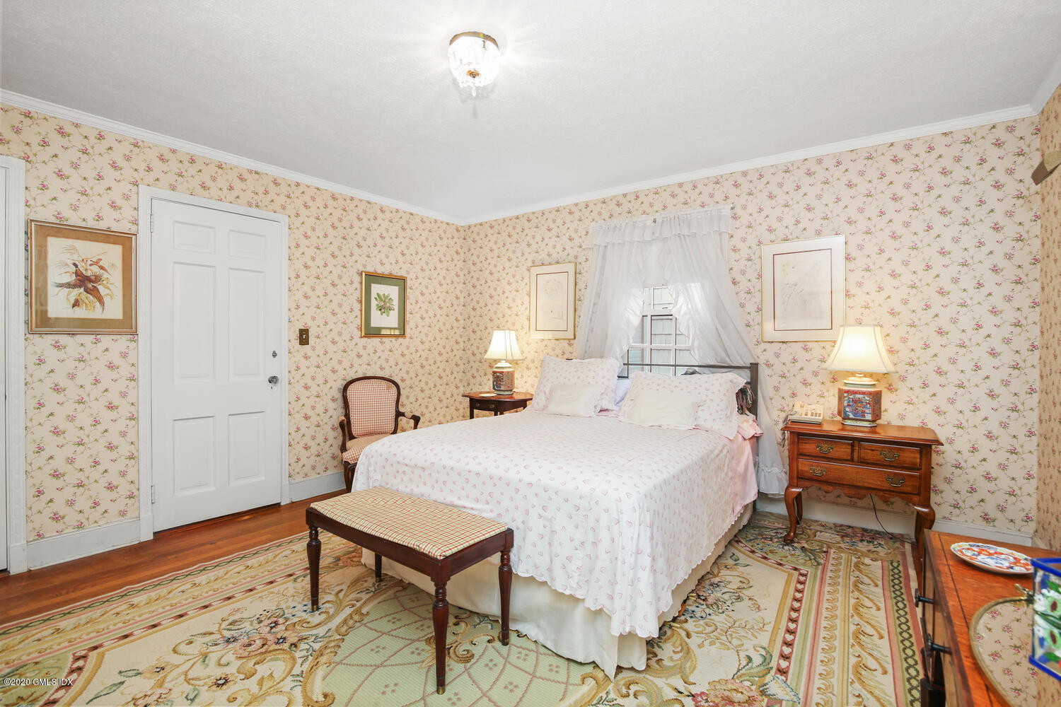 28 Pheasant Lane Greenwich, CT 06830 - Photo 34 of 49 a bedroom with a bed and a table in it