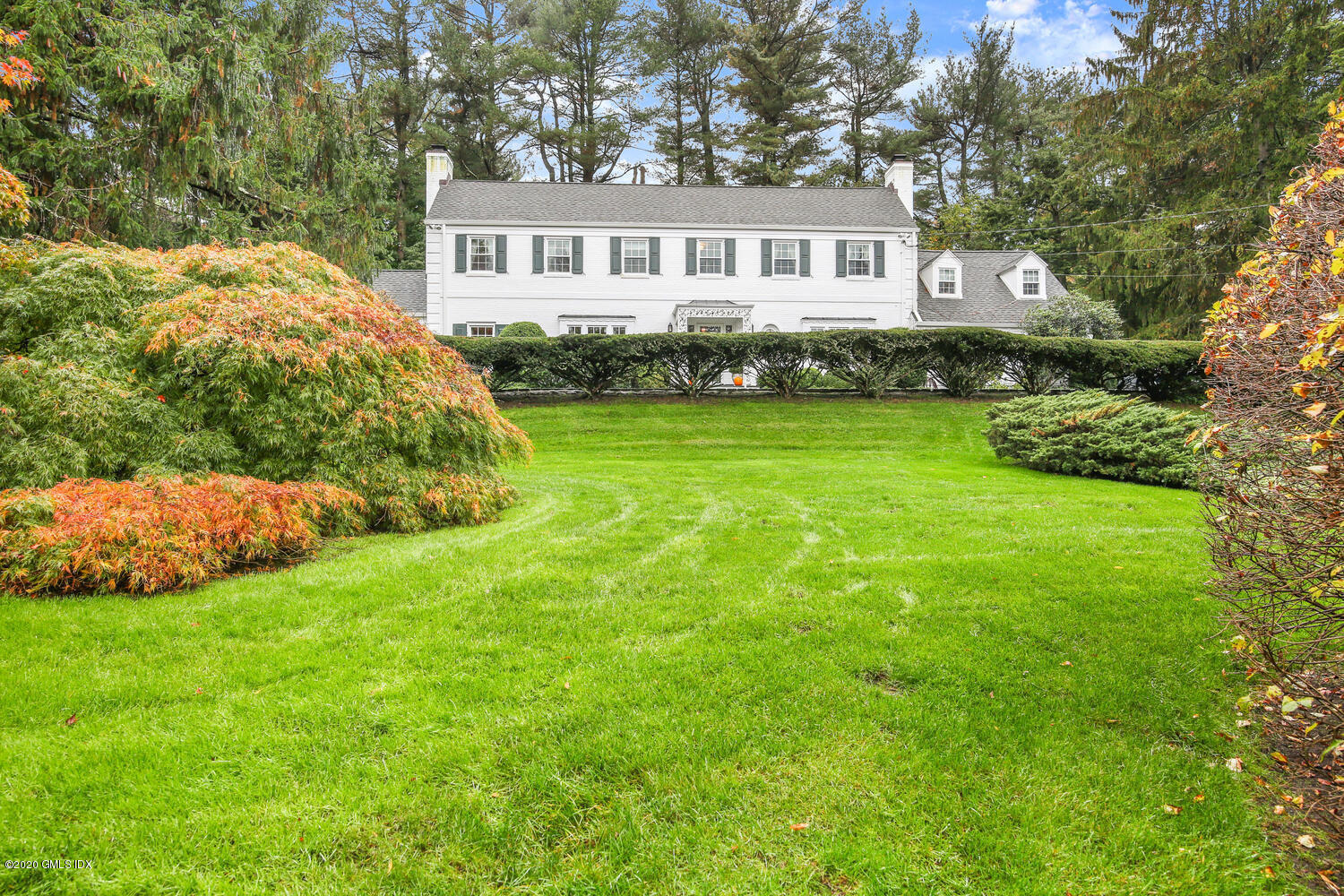 28 Pheasant Lane Greenwich, CT 06830 - Photo 41 of 49 a front view of a house with a garden