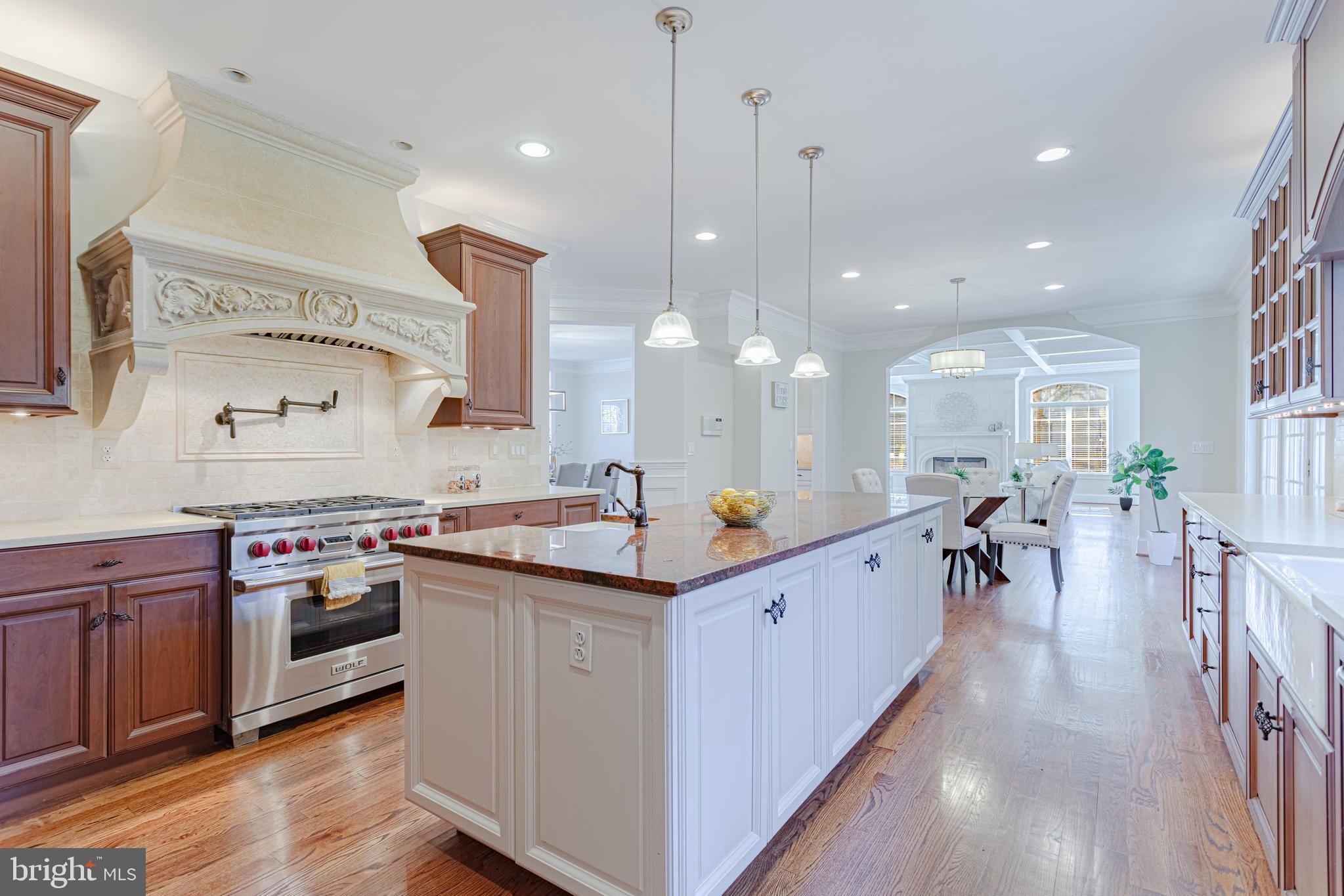 1206 Summit Road McLean, VA 22101 - Photo 12 of 45 a kitchen with stainless steel appliances a stove top oven and a wooden floors