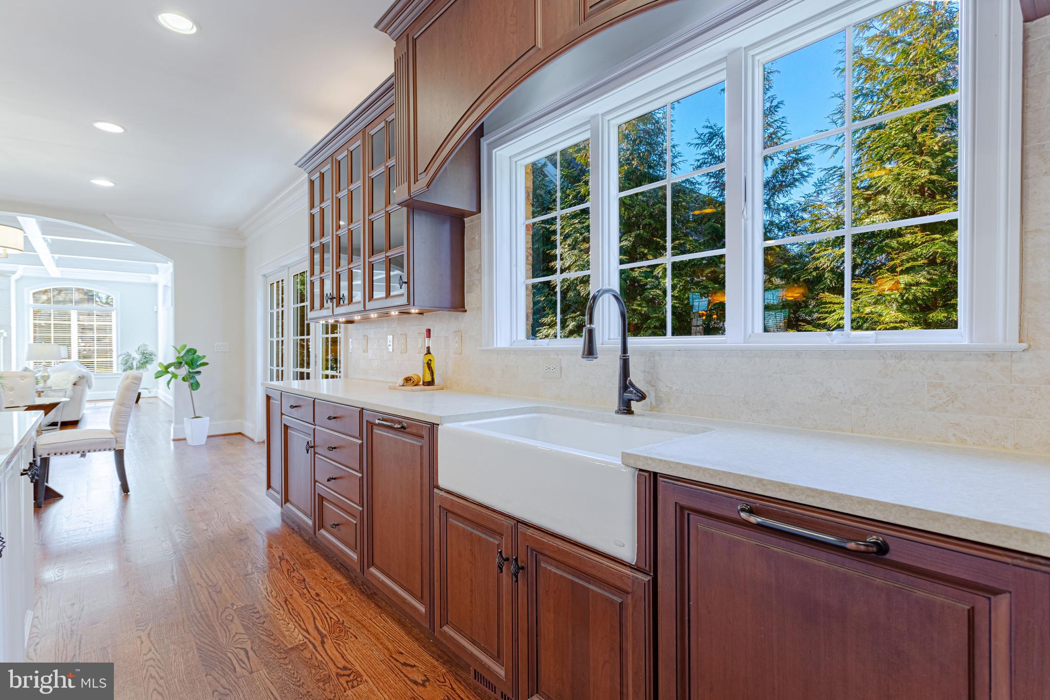 1206 Summit Road McLean, VA 22101 - Photo 13 of 45 a kitchen with a sink a counter top space and living room area