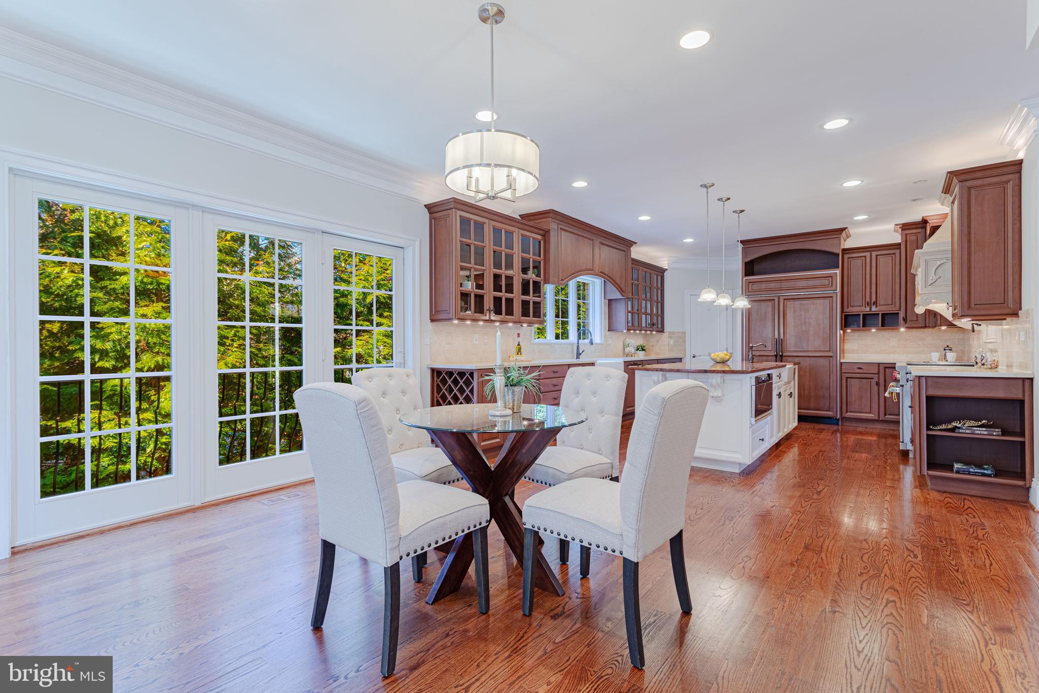1206 Summit Road McLean, VA 22101 - Photo 16 of 45 a view of a dining room with furniture a chandelier and wooden floor