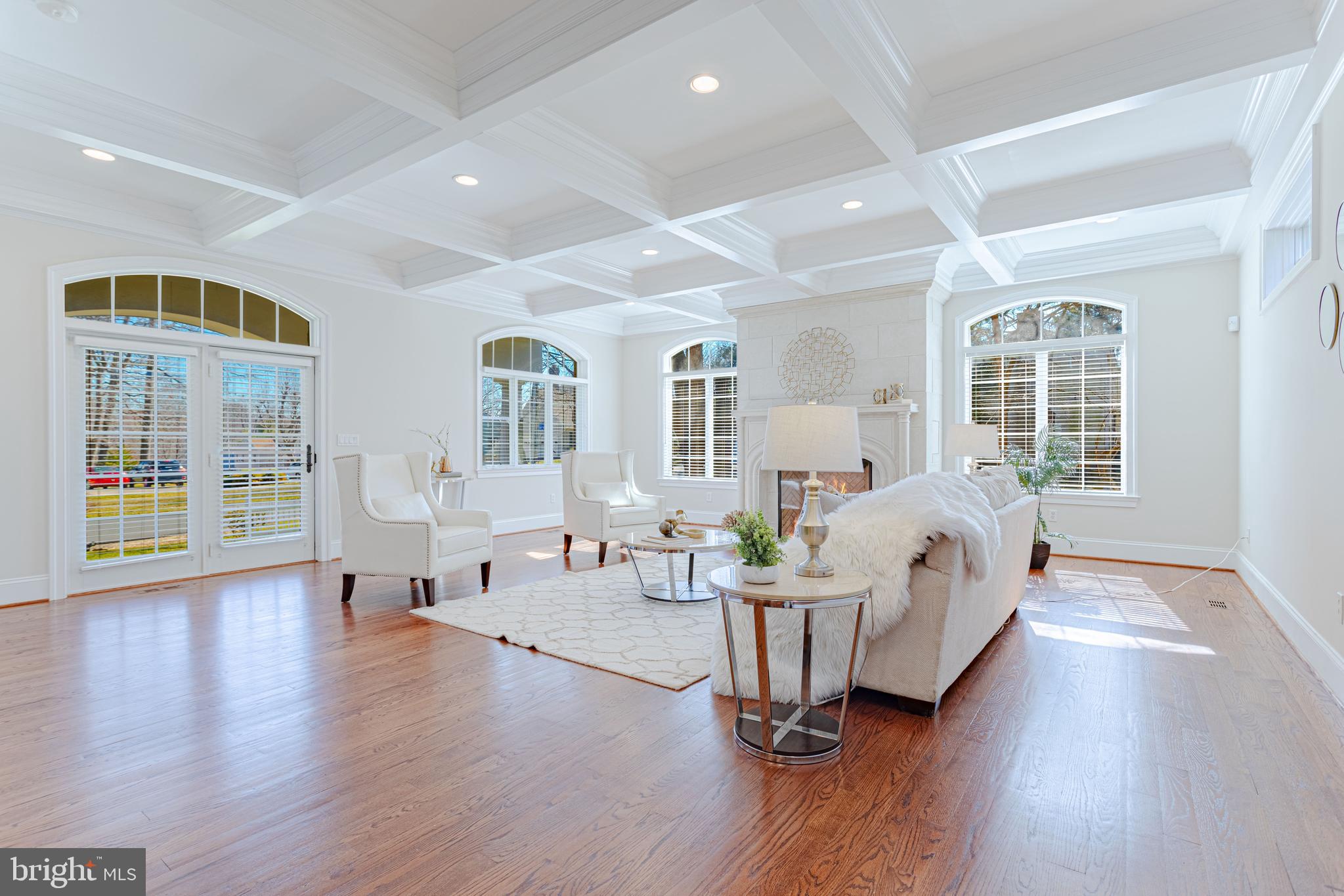 1206 Summit Road McLean, VA 22101 - Photo 19 of 45 a spacious bedroom with a bed a table and wooden floor