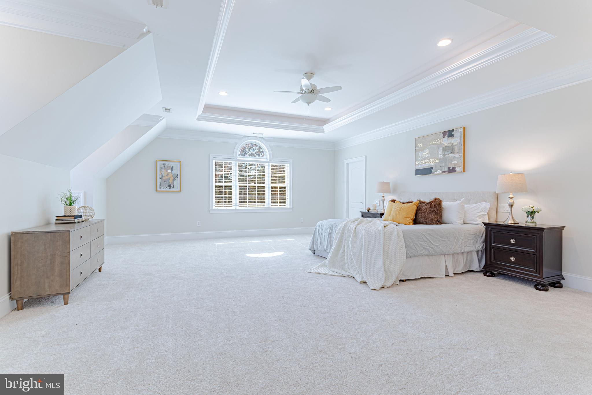 1206 Summit Road McLean, VA 22101 - Photo 22 of 45 a spacious bedroom with a bed and a couch