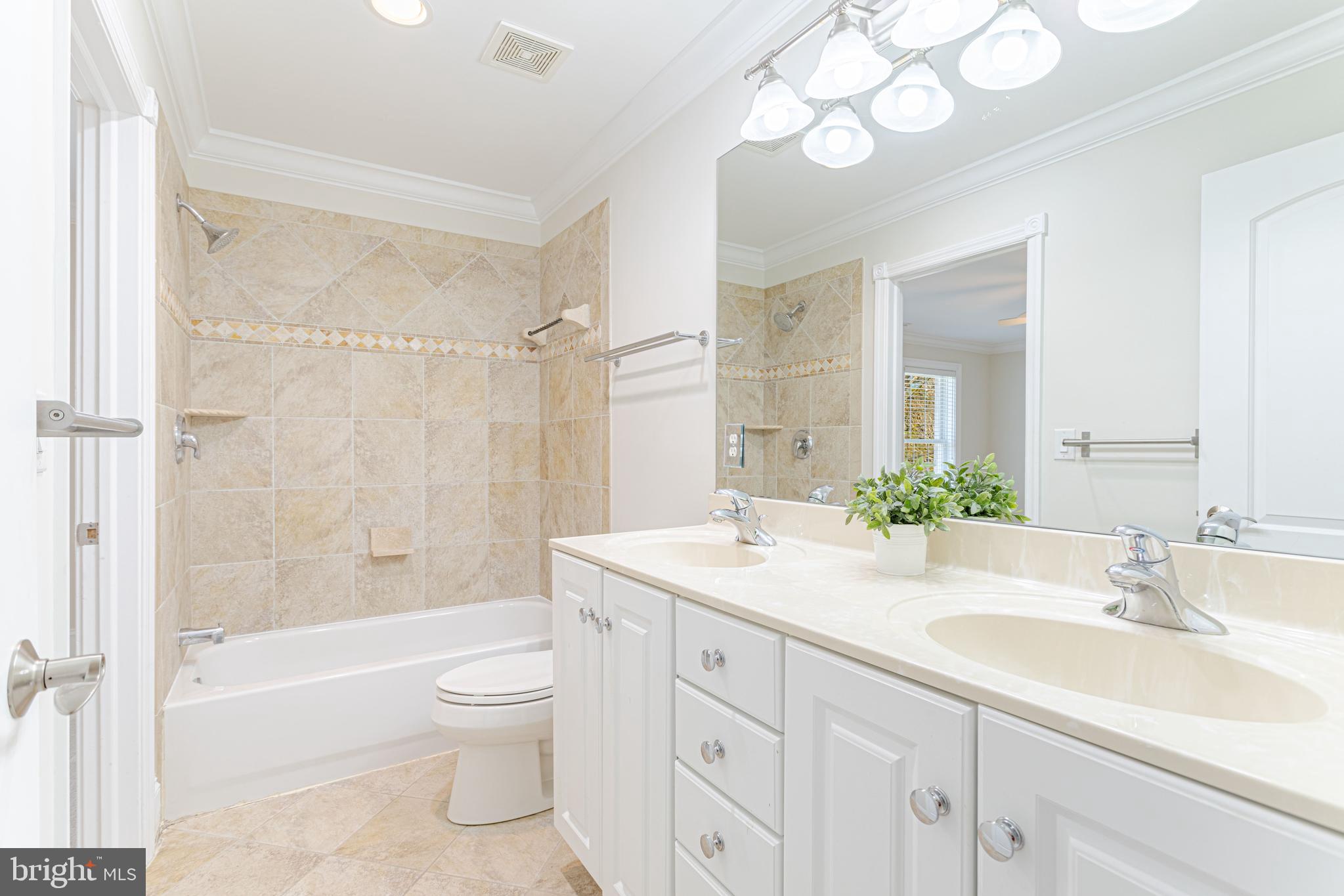 1206 Summit Road McLean, VA 22101 - Photo 27 of 45 a bathroom with a granite countertop sink a toilet and a bathtub