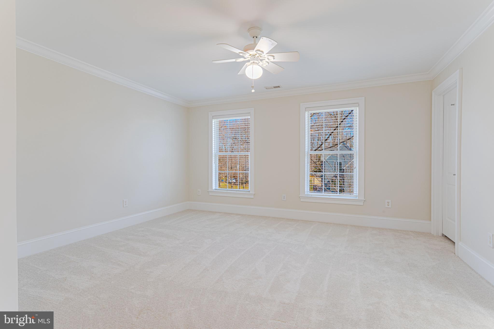 1206 Summit Road McLean, VA 22101 - Photo 28 of 45 an empty room with windows and chandelier fan