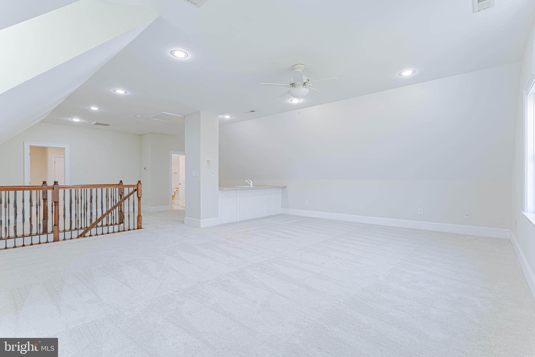 1206 Summit Road McLean, VA 22101 - Photo 33 of 45 an empty room with staircase and white walls