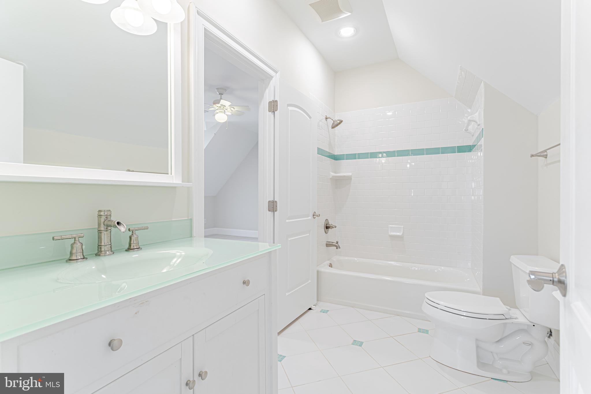 1206 Summit Road McLean, VA 22101 - Photo 36 of 45 a bathroom with a sink a toilet and shower