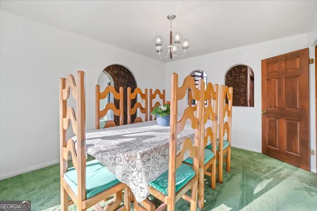 a kitchen with a refrigerator and a stove