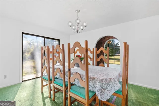 a kitchen with a refrigerator and a sink