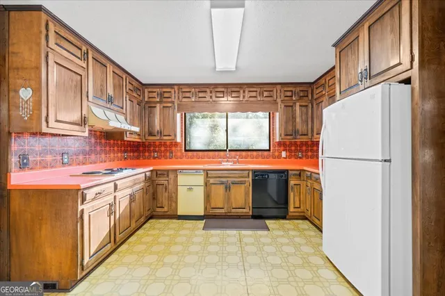 a bathroom with a sink vanity granite tub shower and mirror