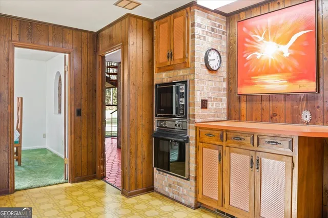 a view of a kitchen with stainless steel appliances granite countertop a refrigerator and a sink